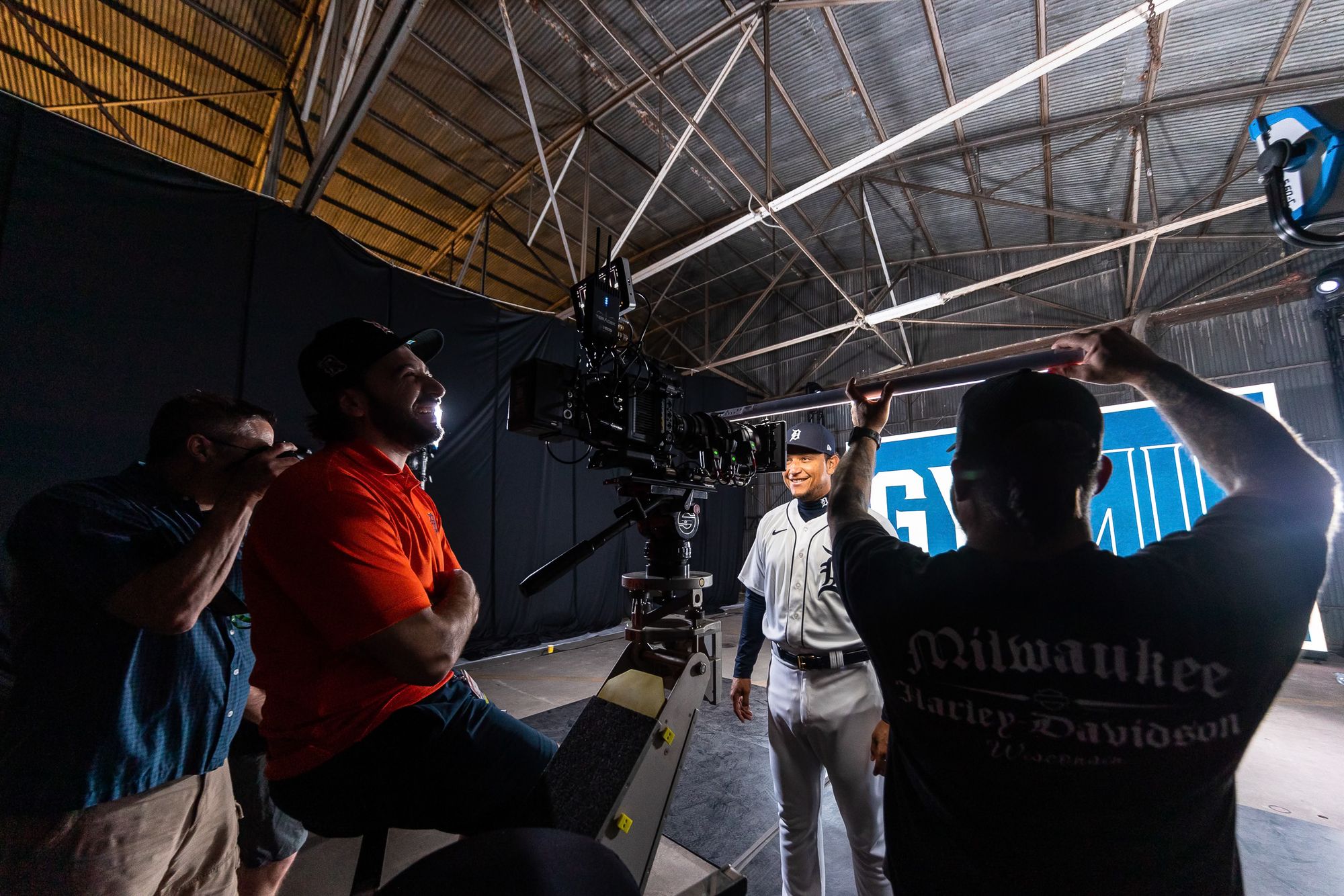 Film crew setting up cameras around a Detroit Tigers player at spring training
